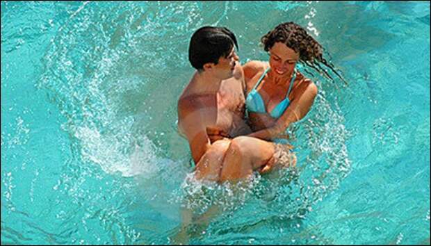 happy-young-woman-and-man-in-pool-thumb13622613