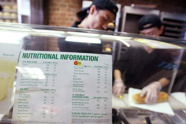 A sign displaying calorie counts is seen in a Subway restaurant in New York City in 2008. A yet-to-be-finalized federal rule requiring big chain restaurants to post calorie counts has likely led eateries to tweak their menus.