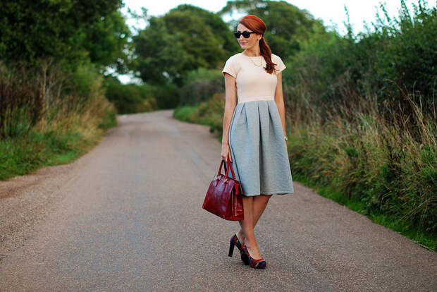 Two-tone full skirted dress and red tote