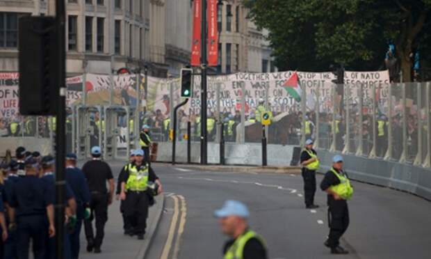 Protestors outside the security cordon before the Nato summit dinner in Cardiff last night.