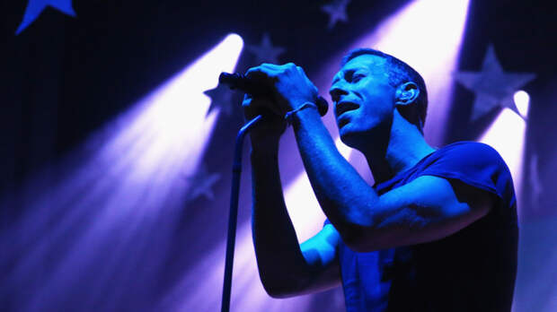 Chris Martin of Coldplay performs for fans in Australia. Coldplay is one act being asked to pay the NFL in exchange for performing at next year's Super Bowl.